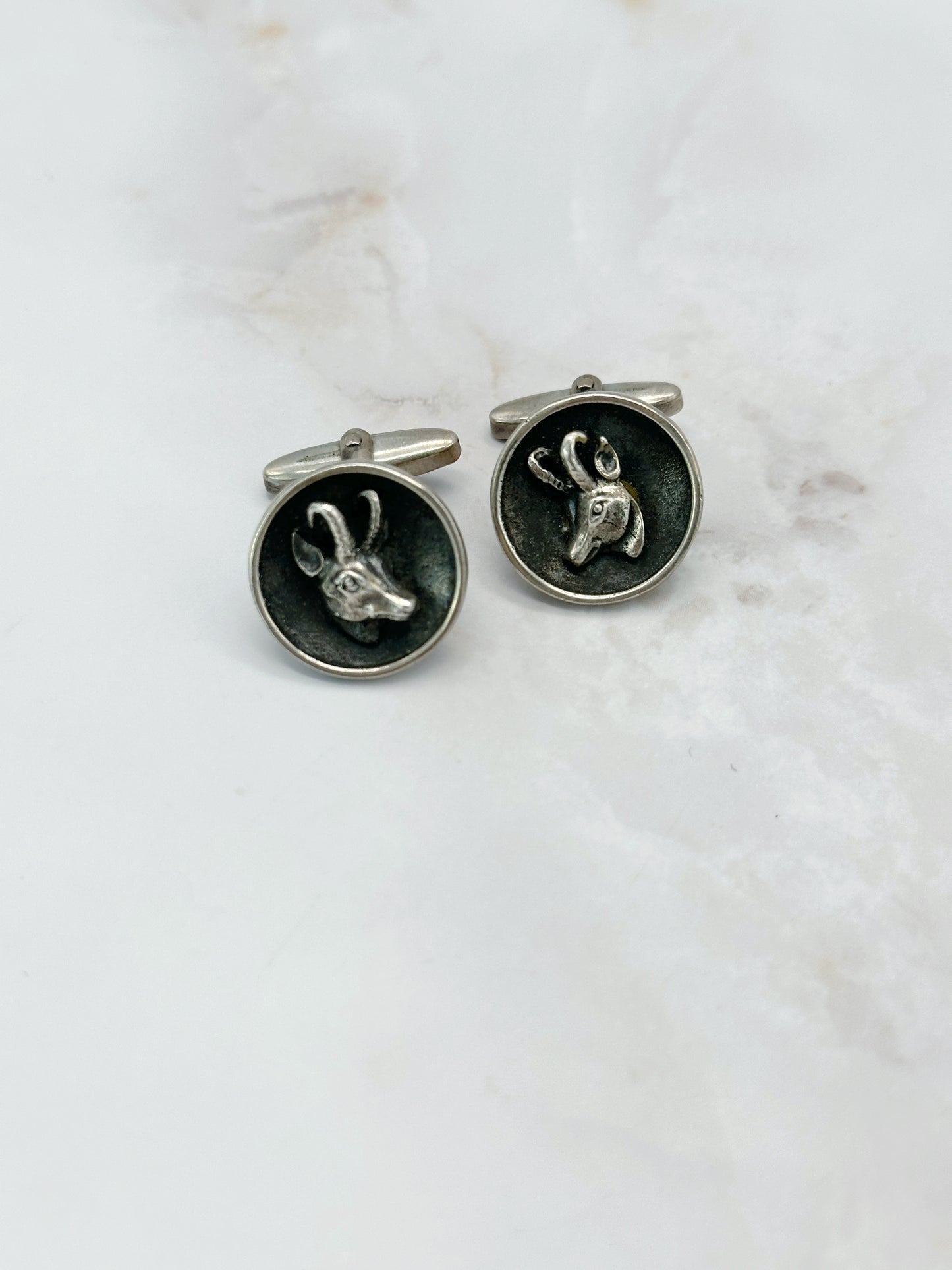 Manschettenknöpfe aus Silber mit Steinbock-Motiv